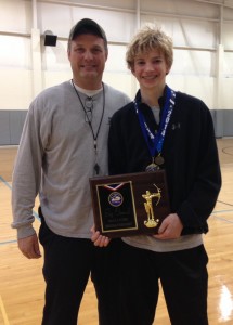 Trinity archery team coach Rick McCauley and Patrick Letterle, who placed first among all Region 6 competitors with a score of 283.