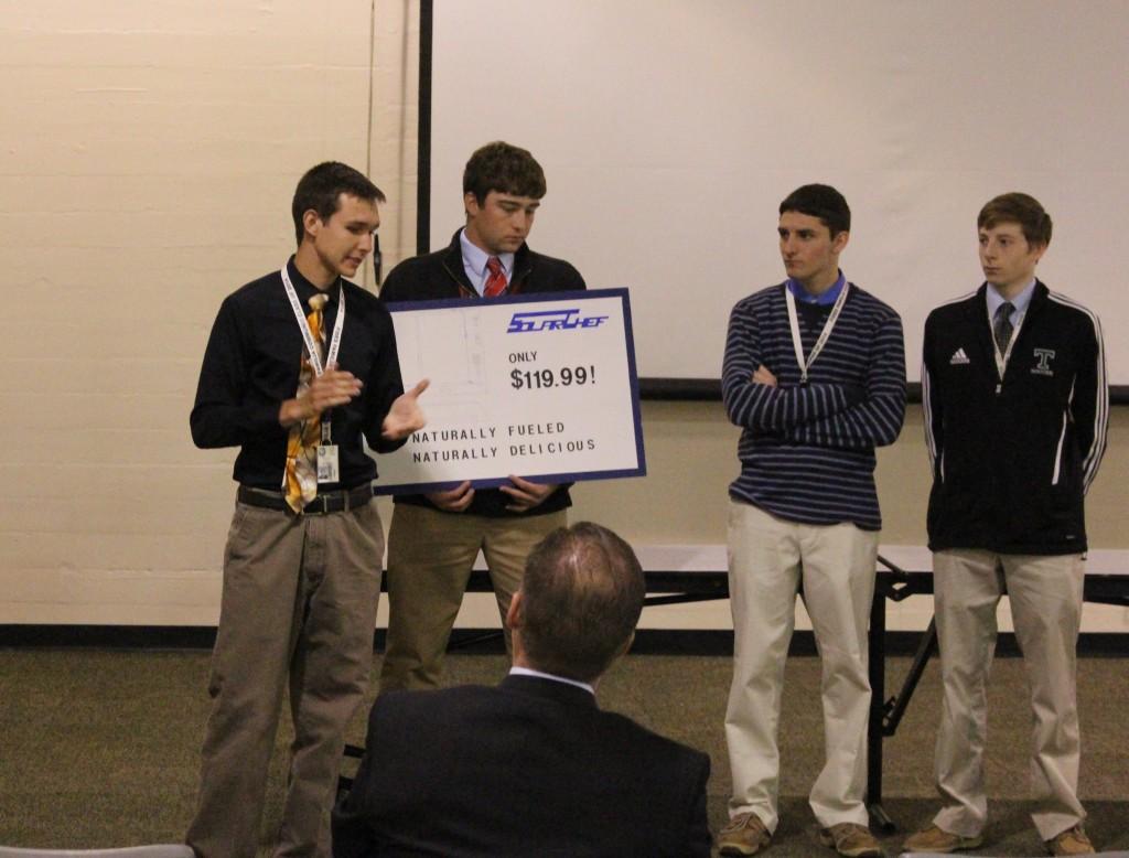 As part of an English class project, seniors Ben Corder, Sean Dageforde, Daniel Volz and Patrick O’Brien presented to "sharks" Mike Daily and Kelly Graef.